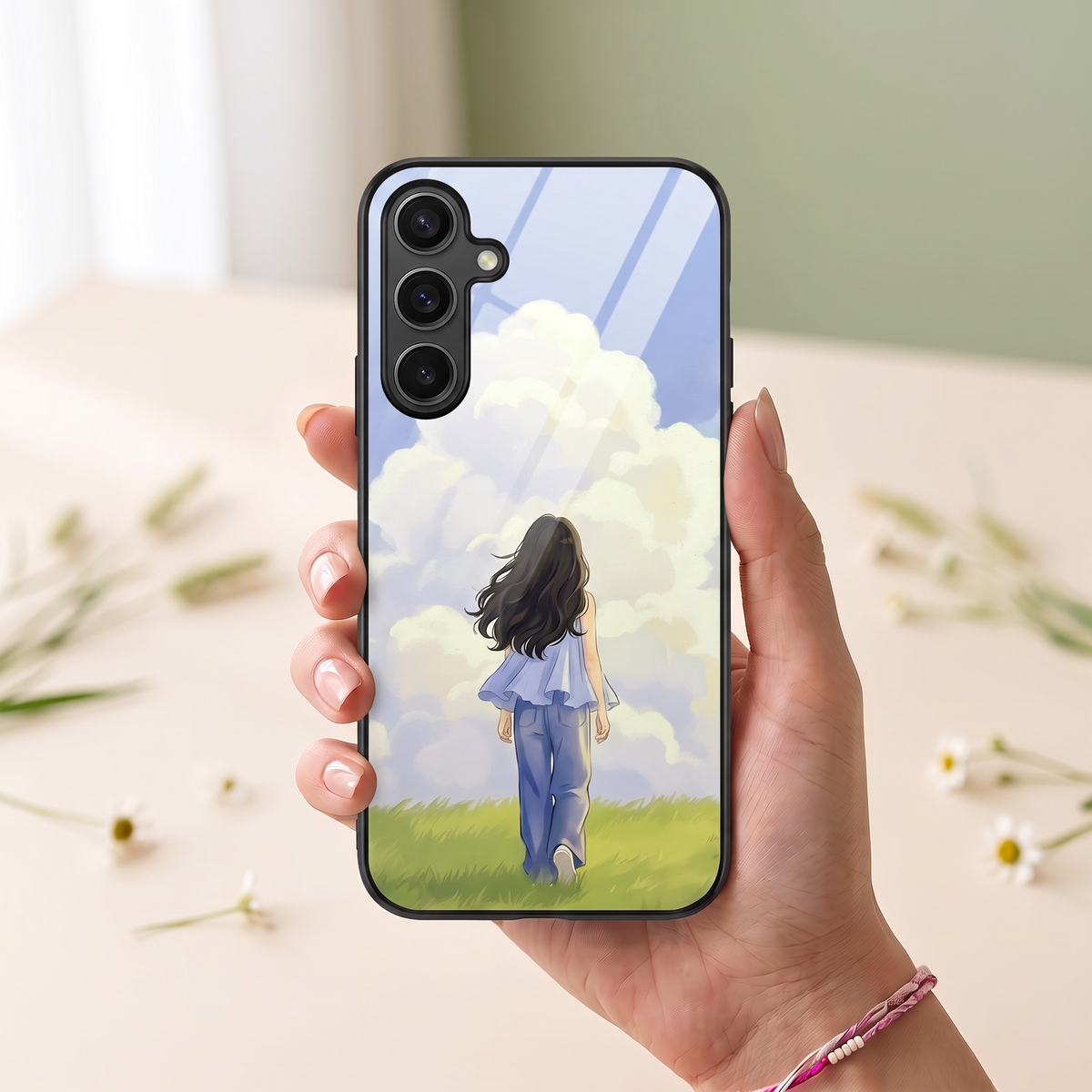 Kase Culture customised phone cover with girl walking in meadow illustration held in hand