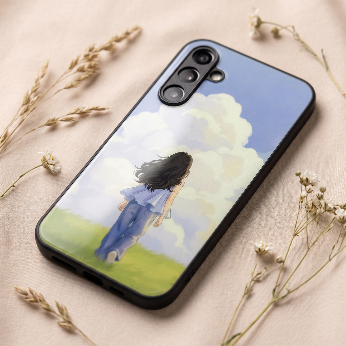 Close-up of girl in meadow phone cover showing triple camera cutout and glossy print