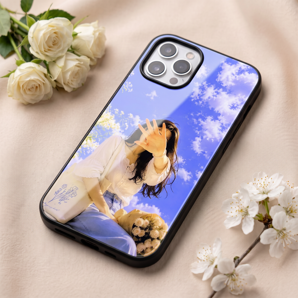 Close-up of girl in clouds phone cover showing glossy print and black border